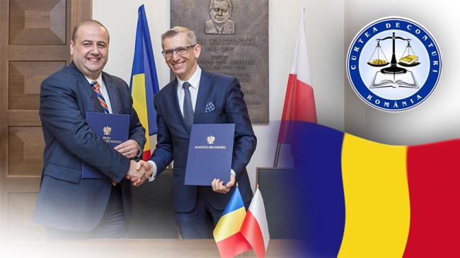 Prezes NOK Rumunii Mihai Busuioc i Prezes NIK Krzysztof Kwiatkowski podpisują porozumienie obok logo NOK Rumunii oraz flaga Rumunii
