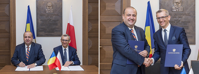 Prezes NOK Rumunii Mihai Busuioc i Prezes NIK Krzysztof Kwiatkowski podpisują porozumienie